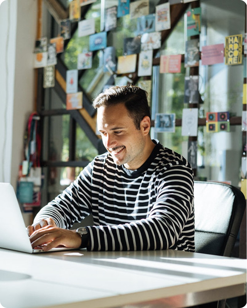 Bootcamp instructor working at a laptop
